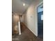 Upstairs hallway with carpet and access to bedrooms and bathroom at 7309 S 17Th Dr, Phoenix, AZ 85041