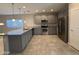 Kitchen with gray cabinets, stainless steel appliances at 7309 S 17Th Dr, Phoenix, AZ 85041