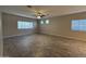 Living room with tile floor, ceiling fan, and windows at 7309 S 17Th Dr, Phoenix, AZ 85041