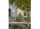 Small side yard with gravel and some shrubs at 7309 S 17Th Dr, Phoenix, AZ 85041