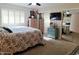 Spacious bedroom with large bed, mirrored closet, and TV at 7813 E Lakeview Ave, Mesa, AZ 85209