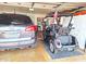 Garage with golf cart and SUV at 7813 E Lakeview Ave, Mesa, AZ 85209