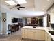 Open kitchen with island and breakfast bar at 7813 E Lakeview Ave, Mesa, AZ 85209