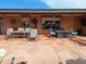 Spacious patio with dining furniture and fire pit at 7813 E Lakeview Ave, Mesa, AZ 85209