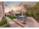 Private backyard with patio furniture and lush green grass at 8100 E Camelback Rd # 175, Scottsdale, AZ 85251