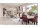 Bright dining area with a round table and chairs, near a fireplace at 8100 E Camelback Rd # 175, Scottsdale, AZ 85251