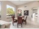 Casual dining area with a round table and chairs, near large window at 8100 E Camelback Rd # 175, Scottsdale, AZ 85251