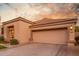 Front view of house with attached garage and neutral color scheme at 8100 E Camelback Rd # 175, Scottsdale, AZ 85251