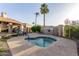 Community hot tub with surrounding patio and landscaping at 8100 E Camelback Rd # 175, Scottsdale, AZ 85251