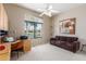 Home office with a desk, sofa, and large window at 8100 E Camelback Rd # 175, Scottsdale, AZ 85251