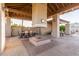 Outdoor patio with fireplace and seating area at 8100 E Camelback Rd # 175, Scottsdale, AZ 85251