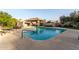 Community pool with lounge chairs and covered patio area at 8100 E Camelback Rd # 175, Scottsdale, AZ 85251