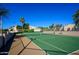 Well-maintained tennis court with surrounding fence at 8100 E Camelback Rd # 175, Scottsdale, AZ 85251