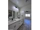 Bright bathroom with double vanity and view of open floor plan at 8306 W Swansea Dr, Arizona City, AZ 85123