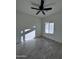 Spacious bedroom with gray wood-look tile floors and ceiling fan at 8306 W Swansea Dr, Arizona City, AZ 85123