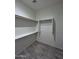 Spacious closet with shelving and hanging rod at 8306 W Swansea Dr, Arizona City, AZ 85123