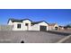 Single-story home with a two-car garage and gravel driveway at 8306 W Swansea Dr, Arizona City, AZ 85123