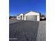 Modern single-story house with gray paver driveway at 8306 W Swansea Dr, Arizona City, AZ 85123