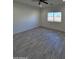 Spacious living room with gray tile flooring and large window at 8306 W Swansea Dr, Arizona City, AZ 85123