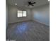 Bright living room with ceiling fan and large window at 8306 W Swansea Dr, Arizona City, AZ 85123