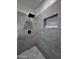 Walk-in shower with grey tile and hexagon floor tile at 8306 W Swansea Dr, Arizona City, AZ 85123