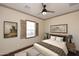 Bedroom with a bed and window with plantation shutters at 8911 E Rusty Spur Pl, Scottsdale, AZ 85255