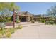 Community clubhouse with covered entryway and landscaping at 8911 E Rusty Spur Pl, Scottsdale, AZ 85255