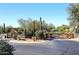 Gated community entrance with desert landscaping at 8911 E Rusty Spur Pl, Scottsdale, AZ 85255