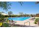 Resort-style pool with lounge chairs and umbrellas at 8911 E Rusty Spur Pl, Scottsdale, AZ 85255