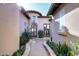 Inviting entryway with a stone path and lush landscaping at 8911 E Rusty Spur Pl, Scottsdale, AZ 85255