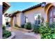 Charming entryway with a stone path and beautiful plants at 8911 E Rusty Spur Pl, Scottsdale, AZ 85255