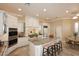 Gourmet kitchen with granite countertops and white cabinets at 8911 E Rusty Spur Pl, Scottsdale, AZ 85255