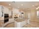 Gourmet kitchen with granite countertops and white cabinets at 8911 E Rusty Spur Pl, Scottsdale, AZ 85255