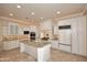 Gourmet kitchen with granite countertops and white cabinets at 8911 E Rusty Spur Pl, Scottsdale, AZ 85255