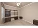 Home office with built-in desk and shelving at 8911 E Rusty Spur Pl, Scottsdale, AZ 85255