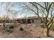 House with solar panels and a gravel backyard at 9403 W Fern Dr, Sun City, AZ 85351