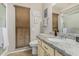 Well-lit bathroom featuring granite countertops and a large window at 9403 W Fern Dr, Sun City, AZ 85351