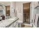 Clean bathroom with granite countertops and updated fixtures at 9403 W Fern Dr, Sun City, AZ 85351