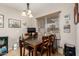 Bright dining area with a wooden table and four chairs at 9403 W Fern Dr, Sun City, AZ 85351