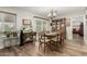 Traditional dining room with hardwood floors and china cabinet at 9403 W Fern Dr, Sun City, AZ 85351