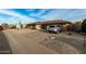 Ranch home with rock landscaping and a car parked at 9403 W Fern Dr, Sun City, AZ 85351