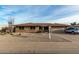 Brick ranch home with a two-car garage and well-maintained yard at 9403 W Fern Dr, Sun City, AZ 85351