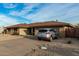 Front view of a ranch house with a car in driveway at 9403 W Fern Dr, Sun City, AZ 85351