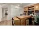 Spacious home office features built-in wood shelving and cabinets at 9403 W Fern Dr, Sun City, AZ 85351