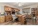 Bright home office with wood desk and built-in shelving at 9403 W Fern Dr, Sun City, AZ 85351