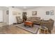 Living room features hardwood floors and neutral decor at 9403 W Fern Dr, Sun City, AZ 85351