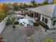 Stunning aerial view of backyard oasis with pool, lush landscaping, and outdoor dining area at 953 E Fieldstone Pl, Chandler, AZ 85249