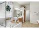 Bathroom featuring a walk-in shower, a soaking tub, and oak vanity at 953 E Fieldstone Pl, Chandler, AZ 85249