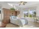 Bright bedroom with lots of natural light, built in shelves, and neutral colors at 953 E Fieldstone Pl, Chandler, AZ 85249