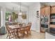 Cozy breakfast nook features wood table and chairs, with lots of natural light, and views of the backyard at 953 E Fieldstone Pl, Chandler, AZ 85249